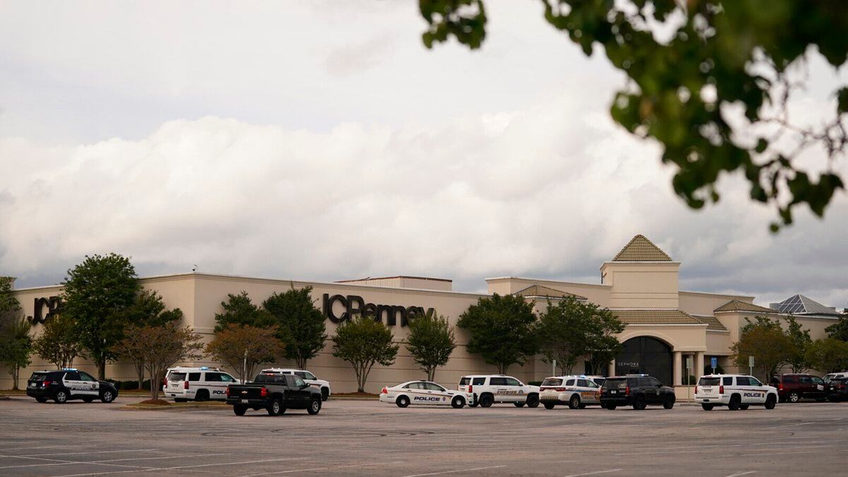 FILE: Authorities stage in a parking lot at Columbiana Centre mall in Columbia, S.C., following...