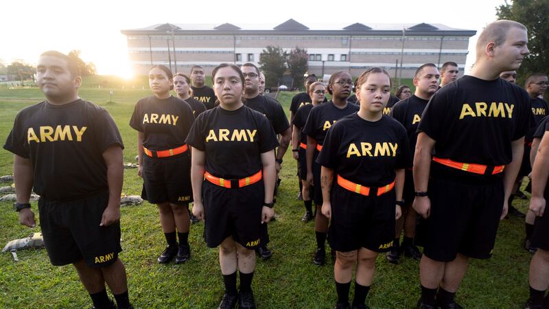 FILE - Students in the new Army prep course stand at attention after physical training...