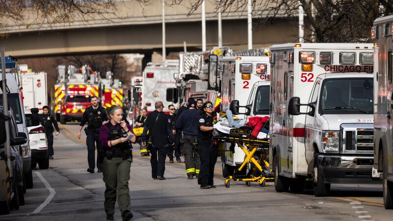 A person is taken away via ambulance after a Chicago Transit Authority train crashed into a...