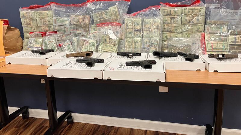 Firearms and money seized during the Spartanburg County Sheriff's Office's Operation Rolling...