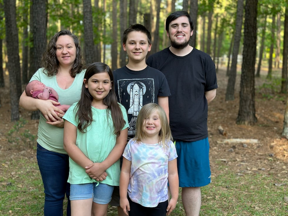 Matthew Williamson and his wife, Kathryn, with four of their children.