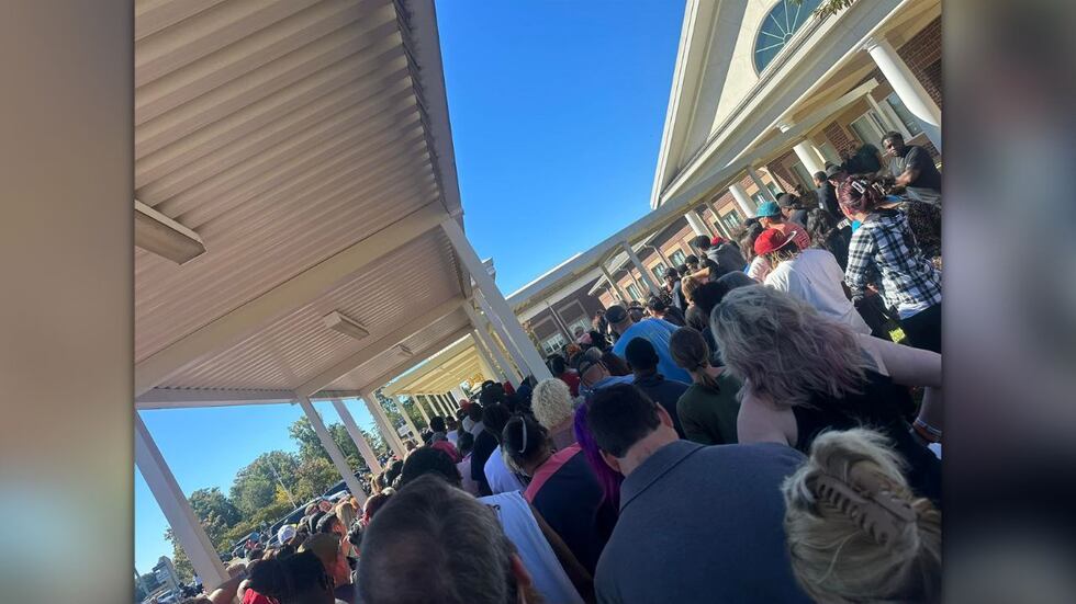 A crowd of parents tries to pick up their children after a fake school shooting threat was...