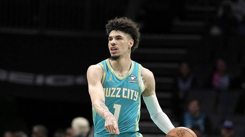Charlotte Hornets guard LaMelo Ball plays against the Miami Heat during the first half of an...