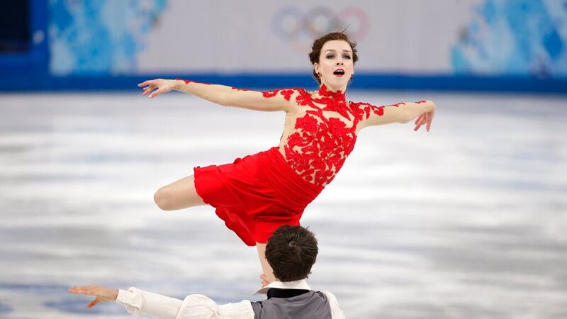 FILE - Alexandra Paul and Mitchell Islam of Canada compete in the ice dance free dance figure...