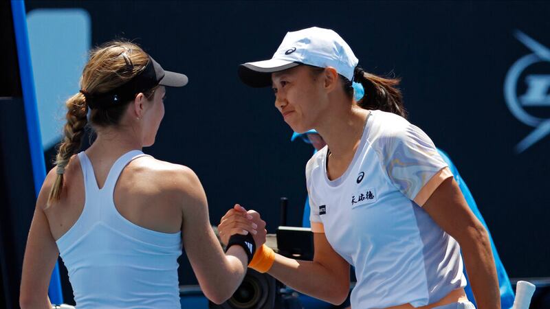 Zhang Shuai, right, of China is congratulated by Katie Volynets of the U.S. following their...