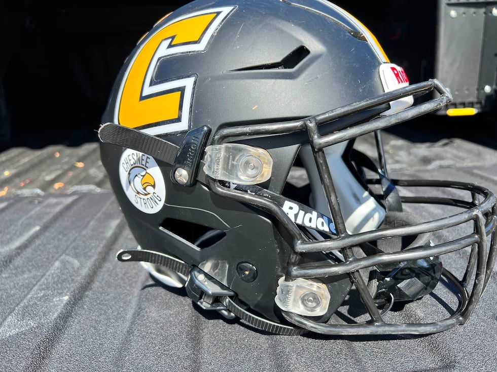 "Chesnee Strong" stickers on high school football players' helmets after tragedy.