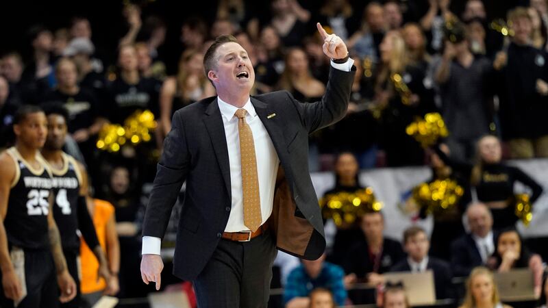Wofford head coach Jay McAuley directs his team against East Tennessee State during an NCAA...