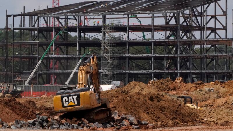 FILE - Construction personnel work on the Carolina Panthers' team headquarters and practice...