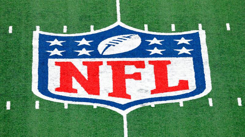 In this Nov. 2, 2020, file photo, the NFL logo is displayed at midfield during an NFL football...
