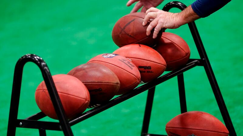 NFL football fans participate in the Super Bowl Experience, Saturday, Feb. 4, 2023, in...